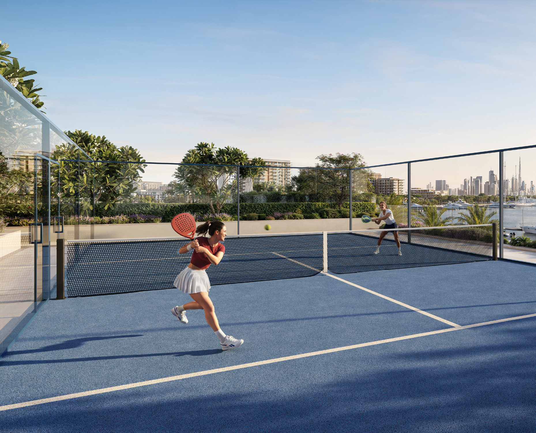 Residents playing padel beside the marina