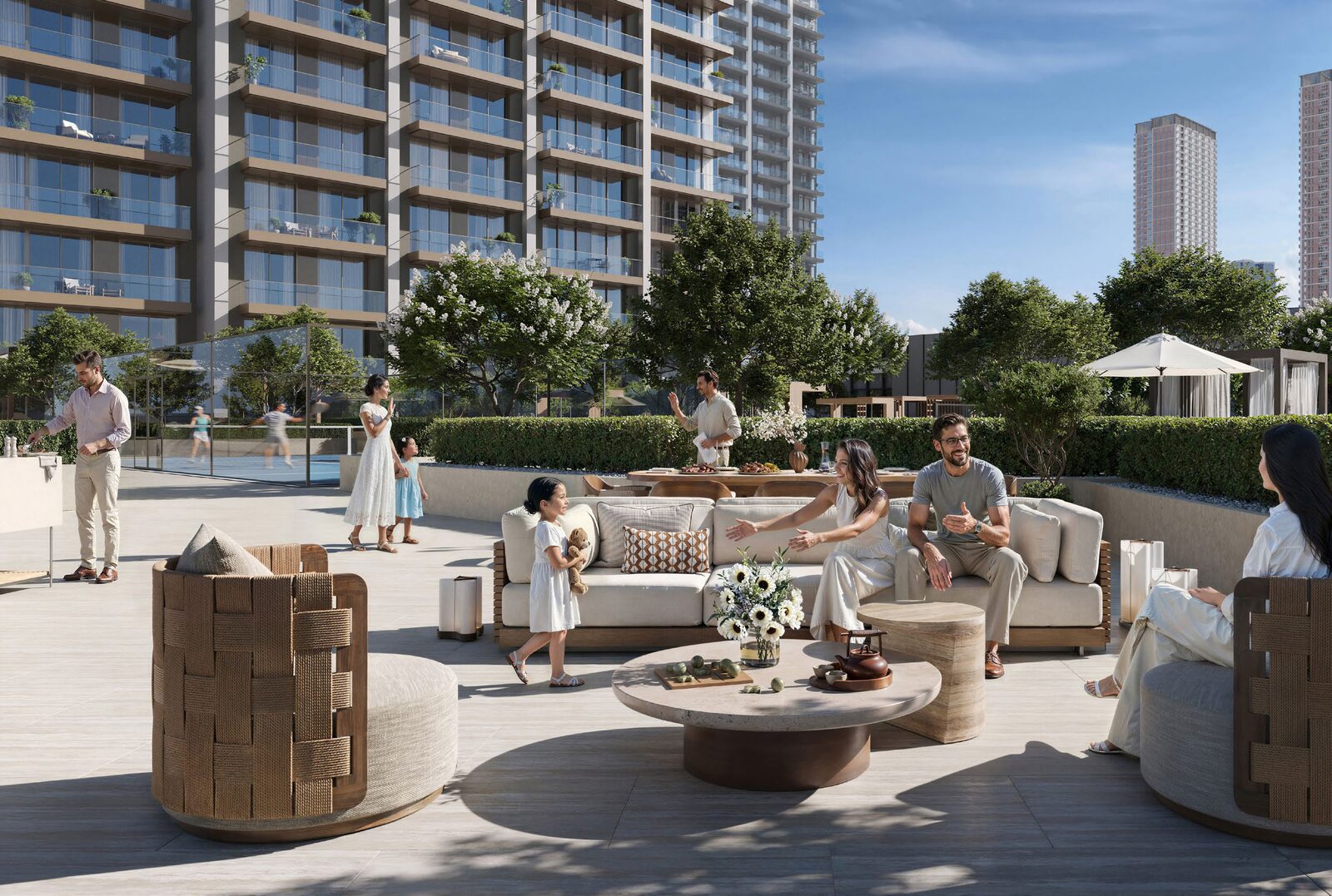 Residents seated on the landscaped podium terrace