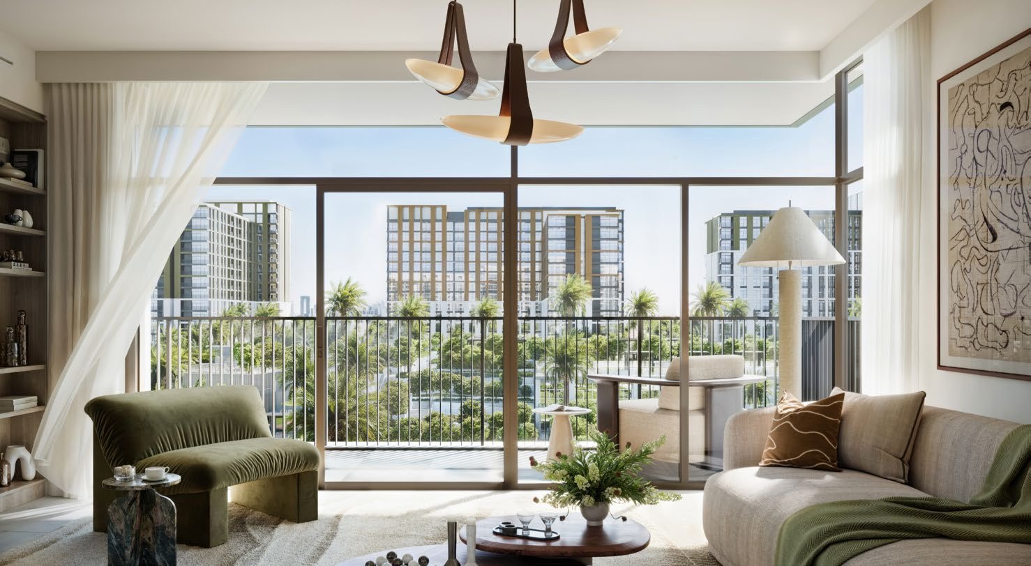 Bright Terra Woods living room with balcony doors and views of greenery