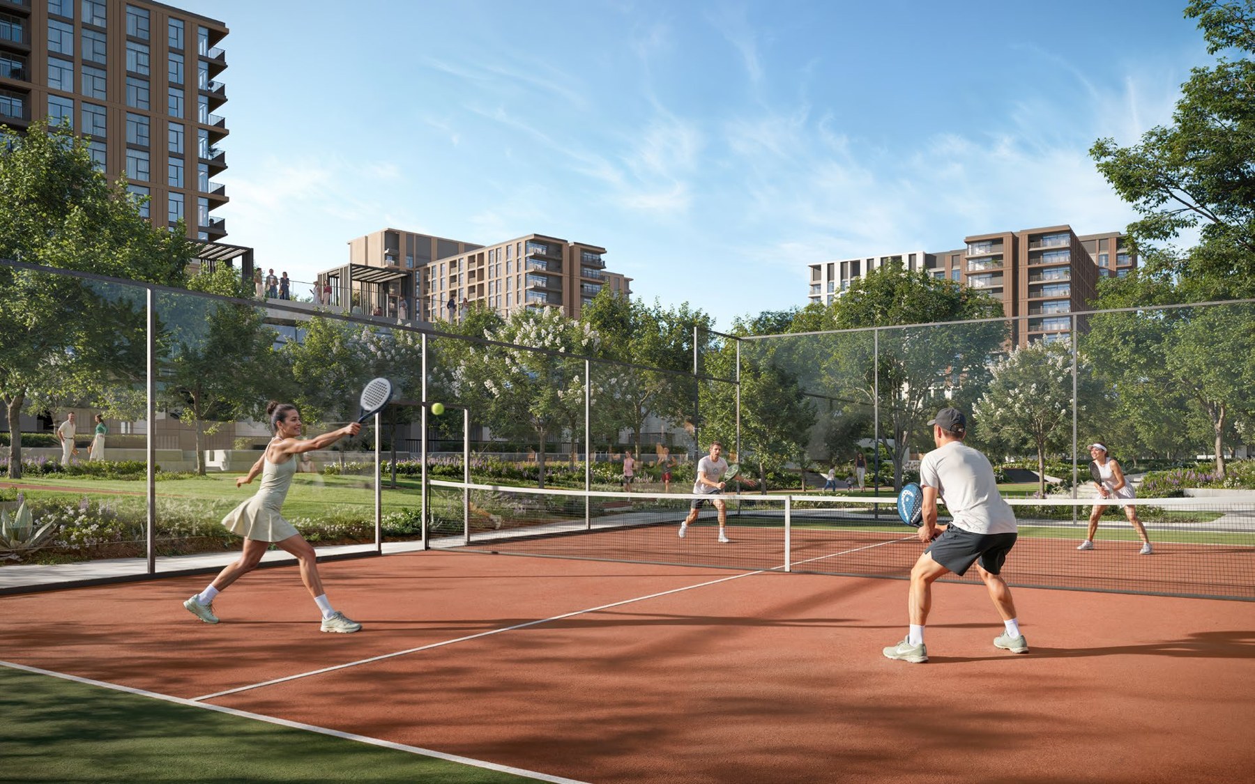 Residents playing padel beside the Terra Woods apartment buildings